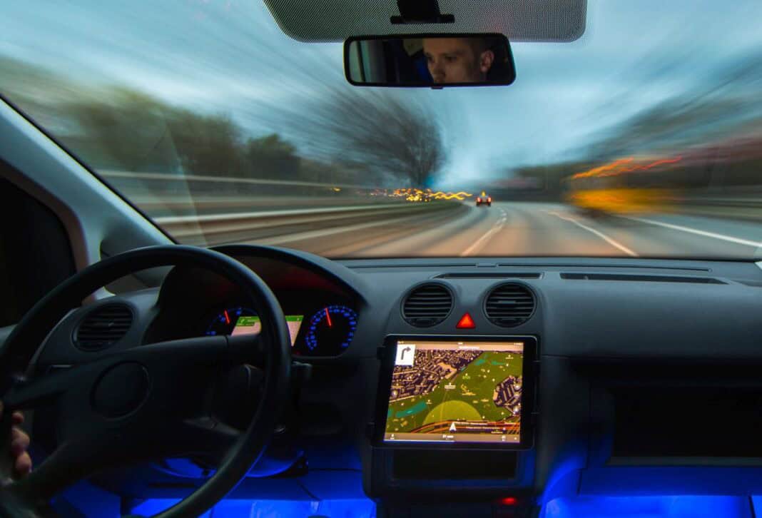 The man drive a car on the highway. Inside view Im Urlaub geblitzt - was tun?